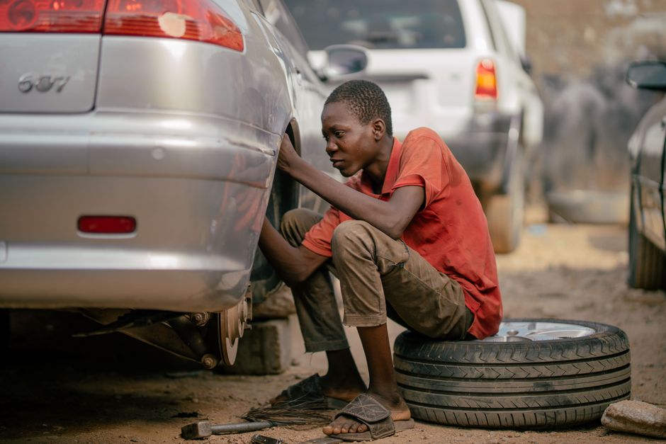 Mechanic changing and balancing a car tire